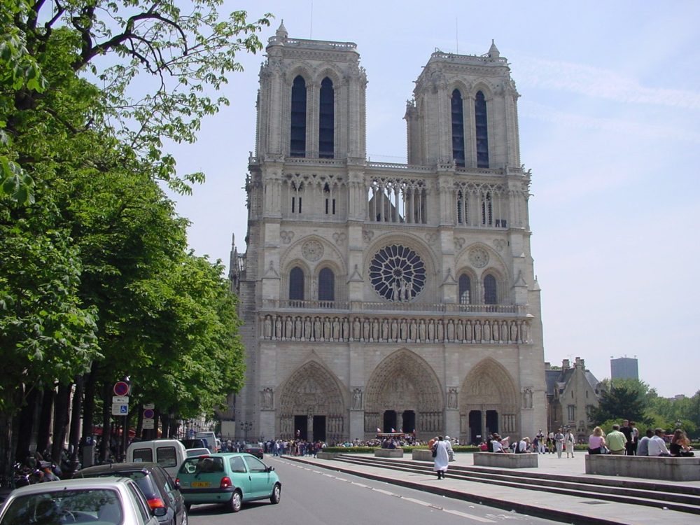 The west front of Notre-Dame de Paris, with its two towers and rose window, seen from the street.