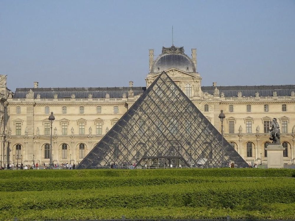 The Louvre palace in Paris, with its glass pyramid in front.